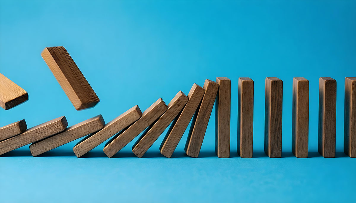 wooden dominos falling over